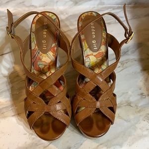 Tan leather  wedge sandal with cork heel.